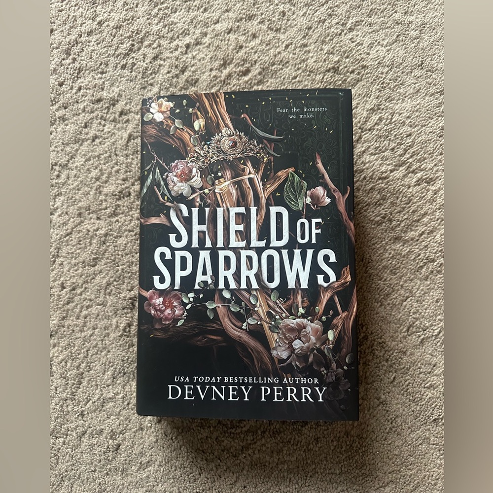 Shield of Sparrows by - Hardcover Book, Black Floral Cover